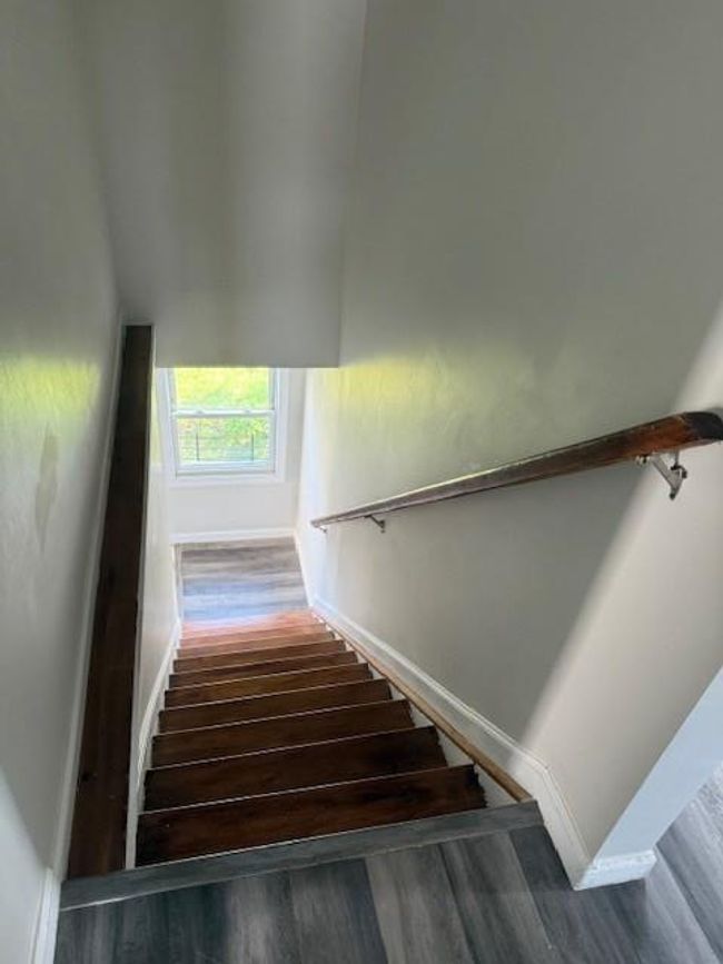 Stairs with wood finished floors | Image 16