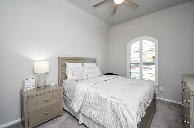 First guest bedroom is lovely with tall ceilings and custom shutters! | Image 4