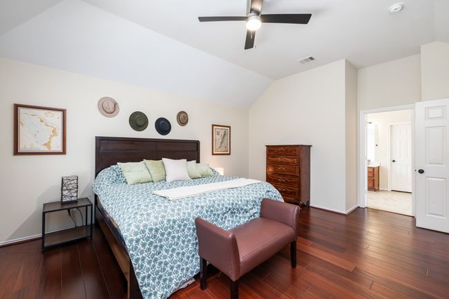 Full bathroom featuring vaulted ceiling, double vanity, and a garden tub | Image 25