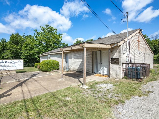 Back, featuring brick siding and a shingled roof | Image 4