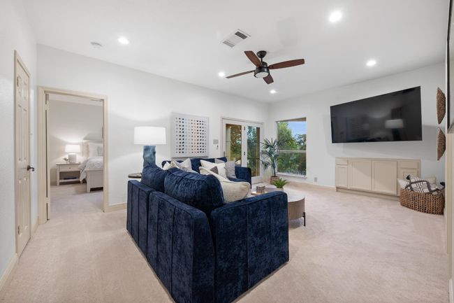 Living area with light colored carpet, a ceiling fan, and recessed lighting | Image 20