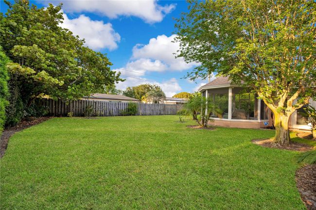 Peaceful covered and screened in gazebo overlooking backyard | Image 26