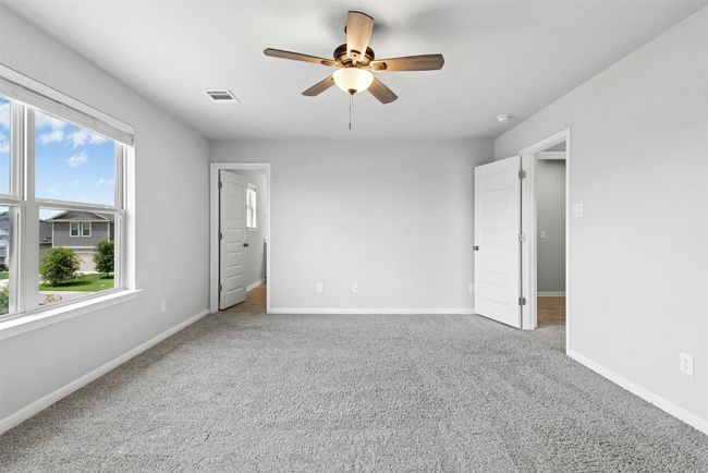 Unfurnished bedroom featuring carpet flooring and a ceiling fan | Image 26