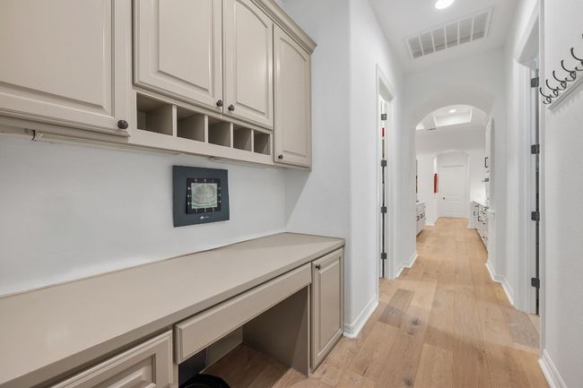 Hallway featuring arched walkways, light wood finished floors, and recessed lighting | Image 28