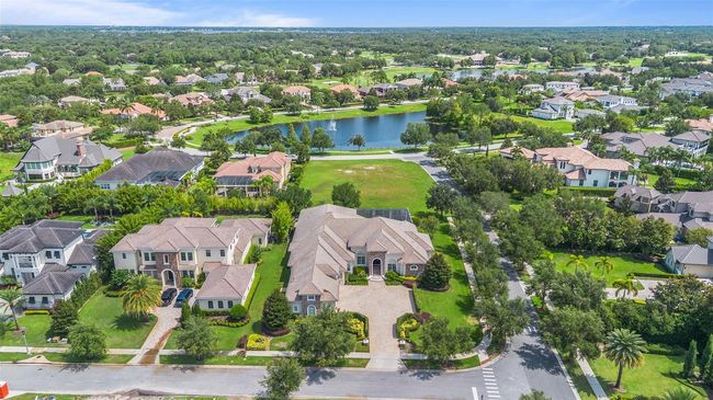 Ideally situated on an oversized lot with no rear neighbors, this stunning Keene’s Pointe estate offers unmatched privacy and picturesque views just steps from tranquil lakefront paths. | Image 31