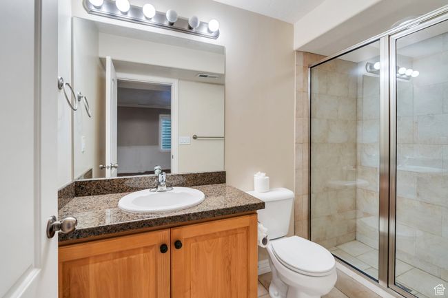 Full bath with vanity, a stall shower, and toilet | Image 19