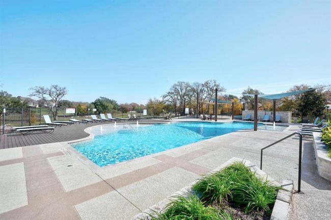 Community pool with a patio | Image 33