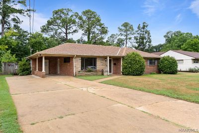 Plenty of parking and a single car carport. | Image 2