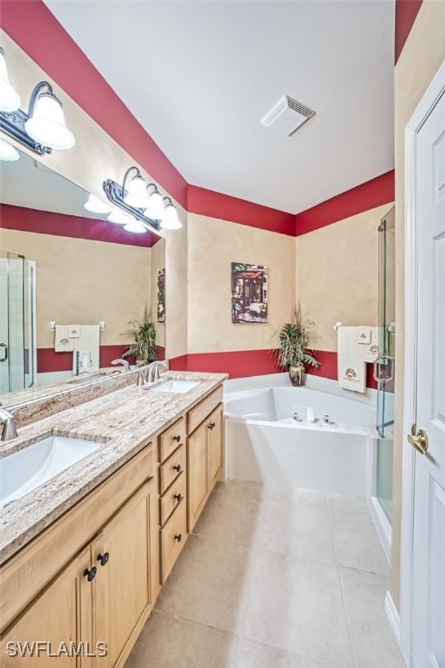 Bathroom with tile patterned flooring, vanity, and plus walk in shower | Image 30