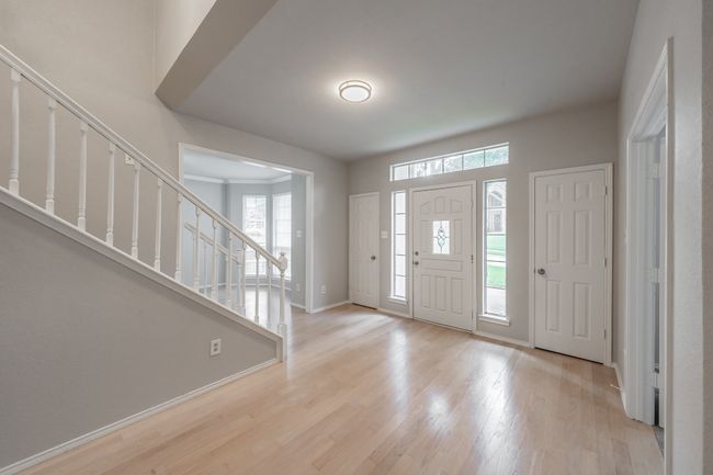 Large entryway with coat closets and space for sitting area or even a Christmas tree! | Image 4