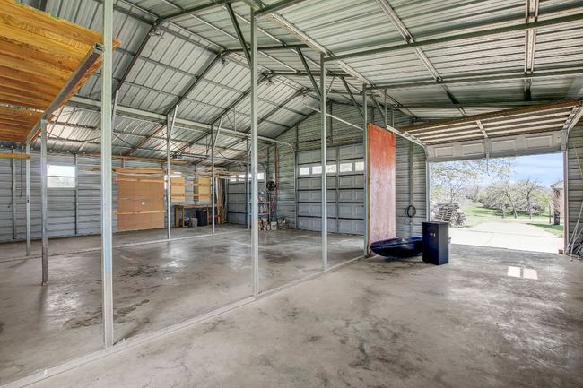 Garage featuring metal wall | Image 23