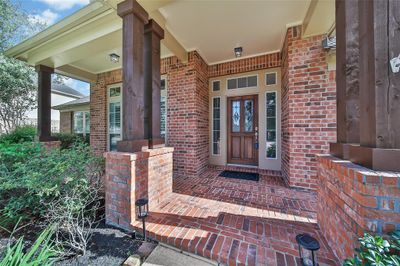 The large front porch is welcoming for you and your guests. Set up chairs to enjoy this tranquil location. | Image 3