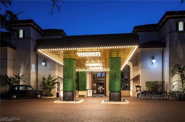 Front of the Bellasera Resort with Valet services and community bicycles | Image 35