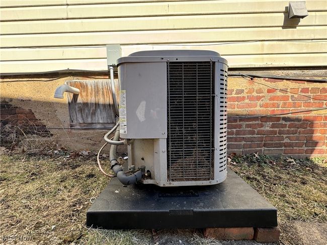 Exterior details with central AC unit and brick siding | Image 31