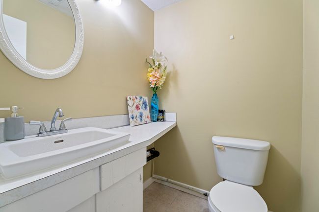 Bathroom with toilet, vanity, and baseboards | Image 15