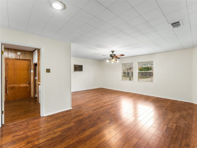 Living room with wood-type flooring and ceiling fan | Image 10
