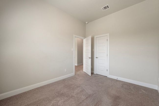 Empty room with carpet floors and baseboards | Image 26