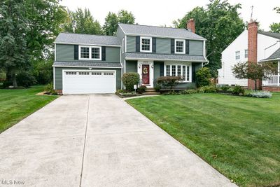 View of front of property with a front lawn and a garage | Image 2