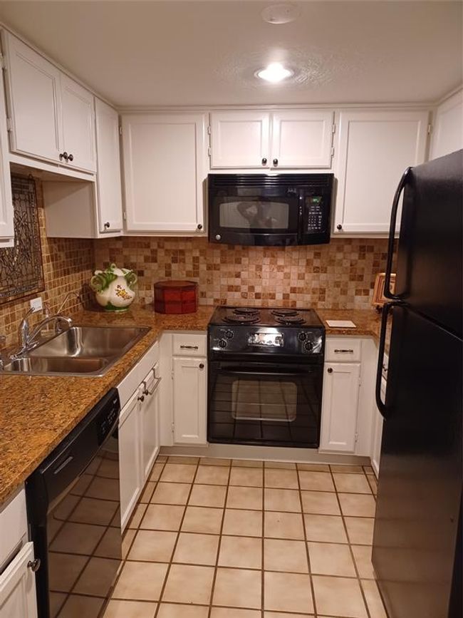 Looking straight into the kitchen while standing at the kitchen entry door. | Image 11