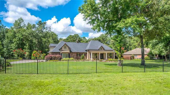 Secure your dream home with freshly painted wrought iron fencing and low-maintenance brick exterior. No Stucco! | Image 4