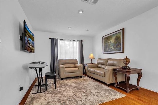 Bright and clean family room in the front of the home. | Image 8
