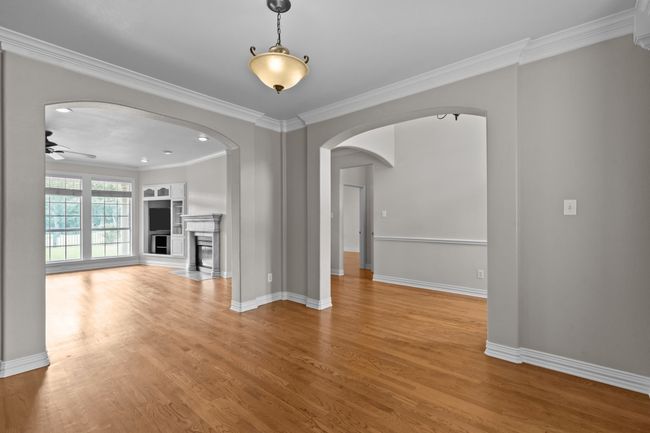 Dining room with gracious windows and stately wood floors | Image 6
