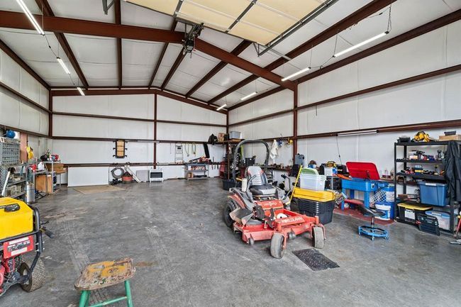 Garage featuring metal wall | Image 46