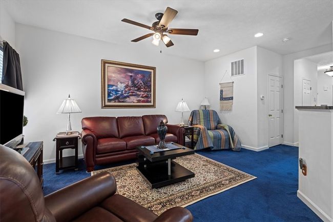 Ceiling fan with light and recessed lighting add light to the space. | Image 9