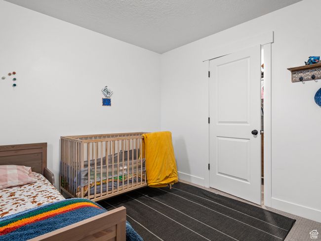 Bedroom with dark colored carpet | Image 33