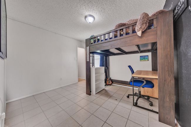 Bedroom 4 has ceramic tile creating a multi-functional room that could serve as an office, gym, study room. Endless possibilities! | Image 17