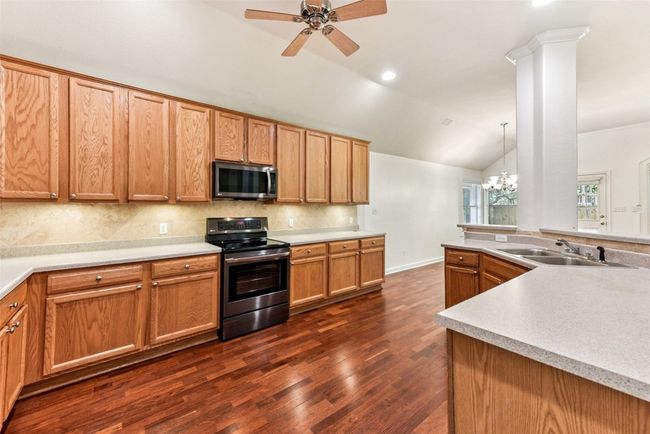 Large kitchen with tons of cabinets and countertop workspace | Image 17