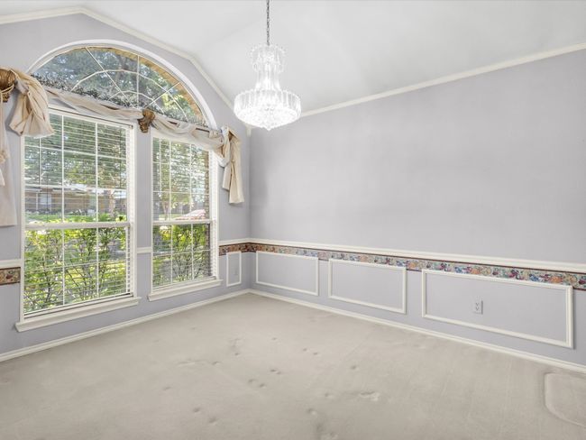Dining room is able to accommodate a large table for hosting family gatherings. | Image 14