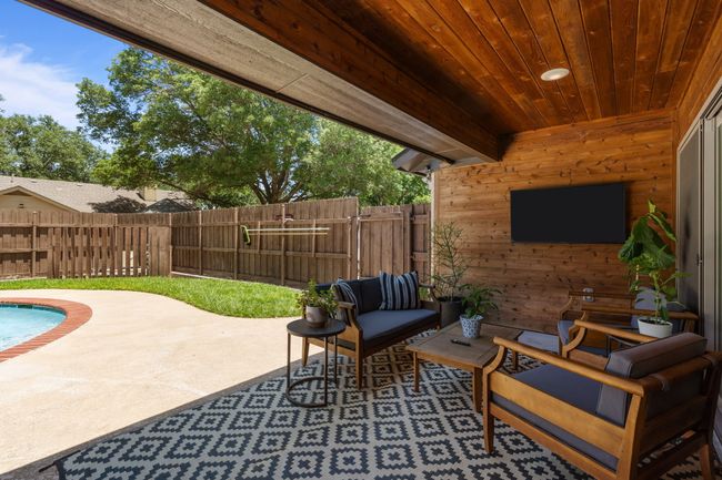Fenced backyard with a patio area and outdoor lounge area | Image 30