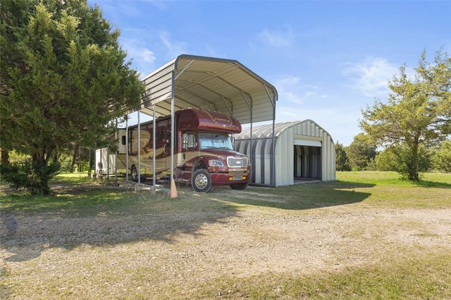 4-car Quonset hut. 40', 30 amp covered RV spot. RV and Trailer Excluded. | Image 31
