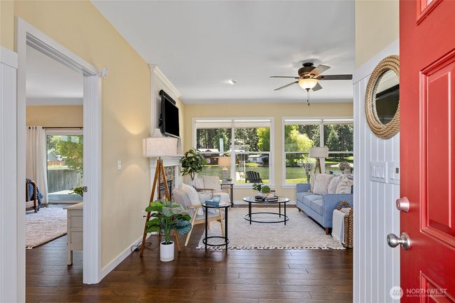 Big picture windows greet you upon entry with large lake views. | Image 5