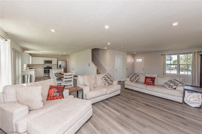 Living room featuring light hardwood flooring | Image 3