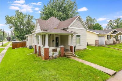 View of front of home featuring a porch and a front lawn | Image 1