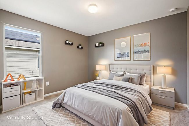 Bedroom with light carpet and baseboards | Image 26