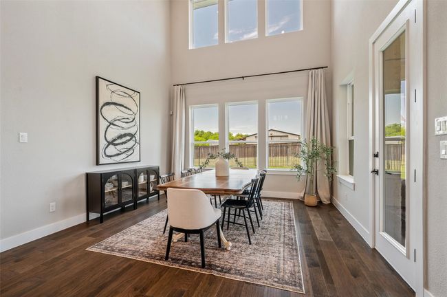 6 large windows look out to the backyard from the kitchen nook making a bright cheerful space. | Image 12