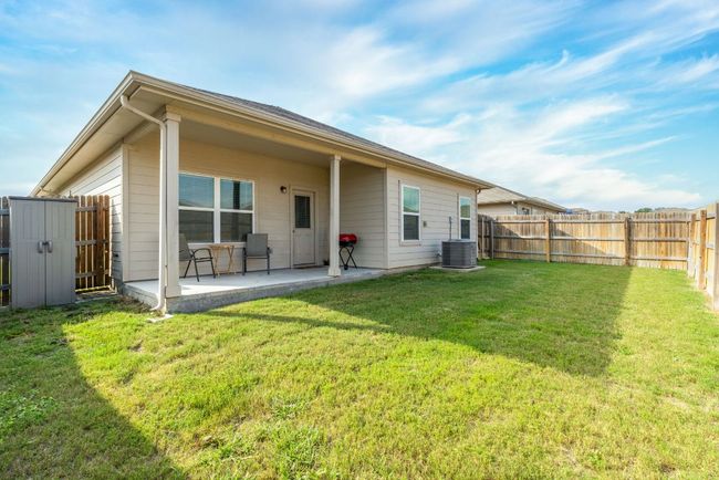Rear view of property with a patio area and central air condition unit | Image 36