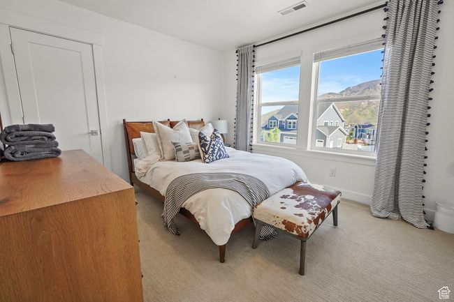Bedroom with carpet floors and baseboards | Image 21