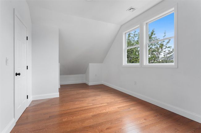 Bonus room featuring lofted ceiling, wood-type flooring, and baseboards | Image 9