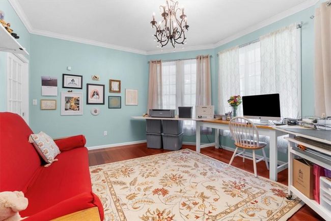 5" Mahoghany flooring. Custom built in shelving w/storage bench under window | Image 20