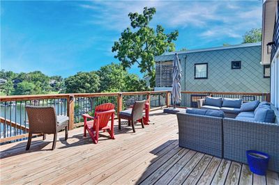 Wooden terrace with an outdoor living space | Image 2