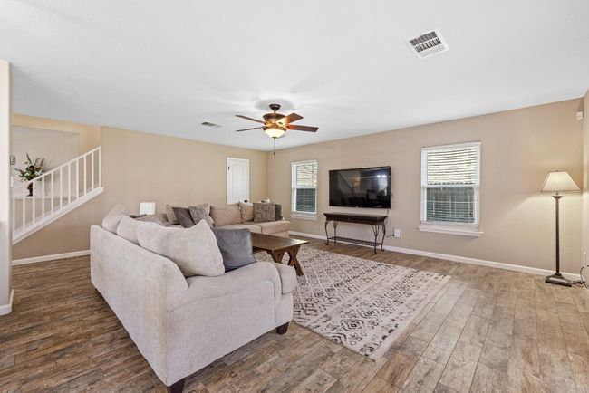 Durable and stylish wood-look tile flooring is easy to maintain while adding warmth to the room. | Image 4