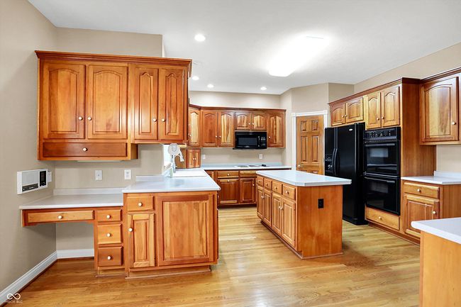 Kitchen with built in desk for workspace | Image 12