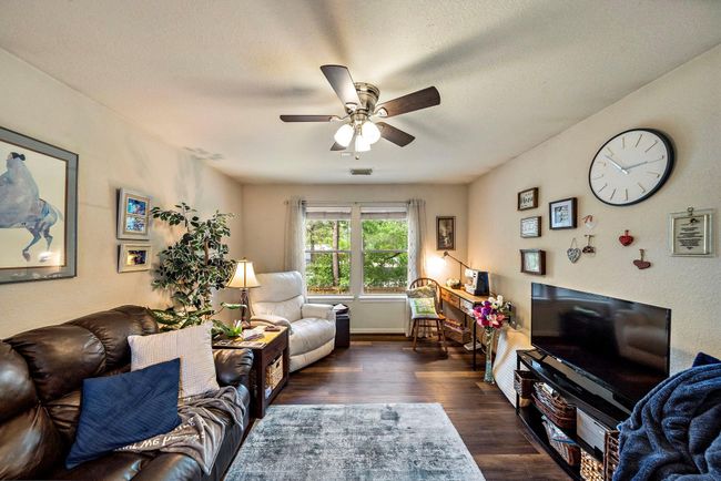 Upstairs family room offers a place to unwind and enjoy a movie night with the family. | Image 5