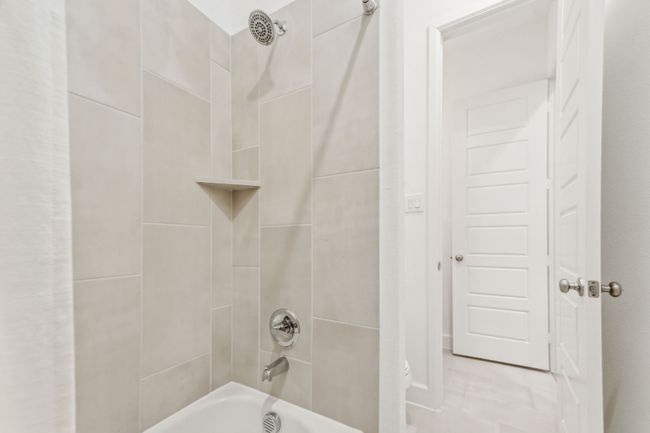 Bathroom featuring shower / tub combination | Image 30