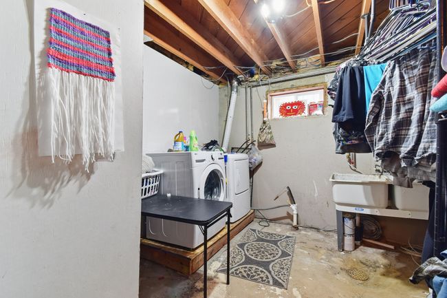 Laundry room featuring washing machine and dryer | Image 30