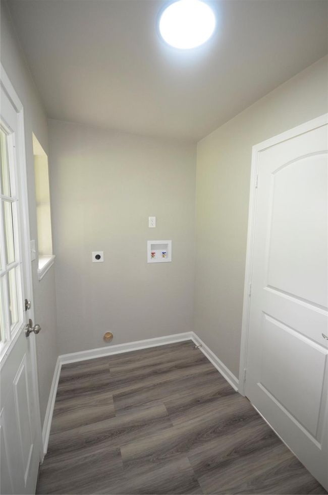 Utility room is conveniently located at the rear of the home. | Image 22